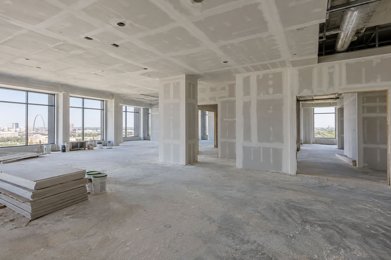 Illustrative commercial office interior with taped drywall walls and ceilings